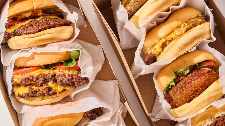 Hamburgers inside of boxes on a table