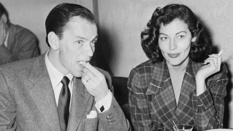 Frank Sinatra eating with Ava Gardner