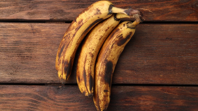Overripe bananas on wood table