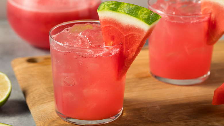 a watermelon cocktail on a pink background