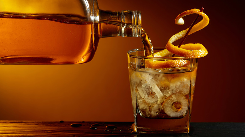 bourbon being poured into a glass