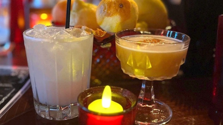 Cocktails on the bar with an electric candle at Ruby in Greenwood, Seattle.