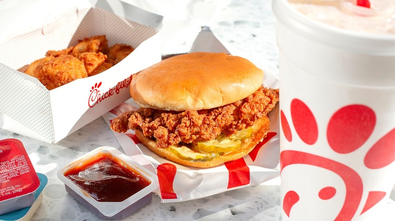 Chick-fil-A chicken sandwich, chicken nuggets, and an open container of sauce