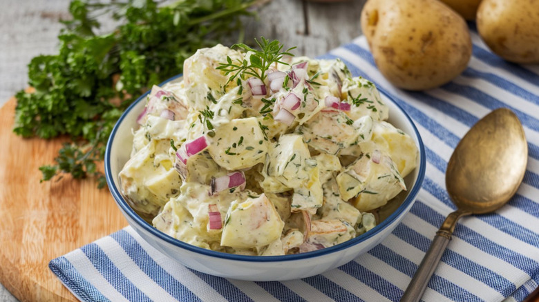 Potatoes tossed in creamy mayonnaise or vinaigrette, enhanced with herbs and onions.