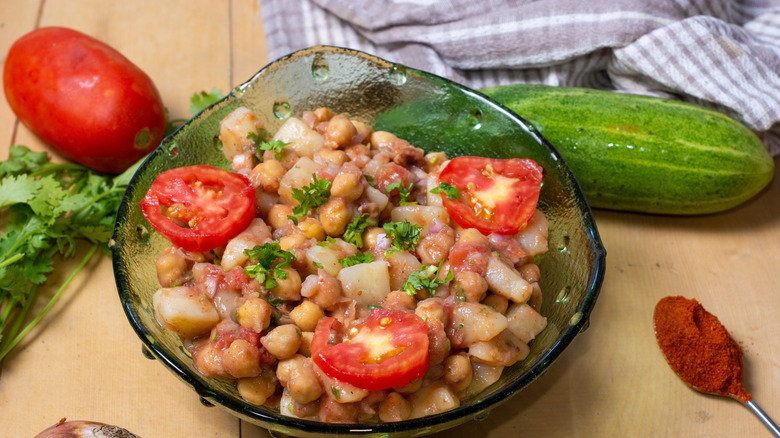 Chickpea and potato chaat in a glass bowl