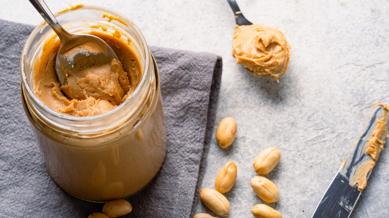 Jar of peanut butter with a spoon