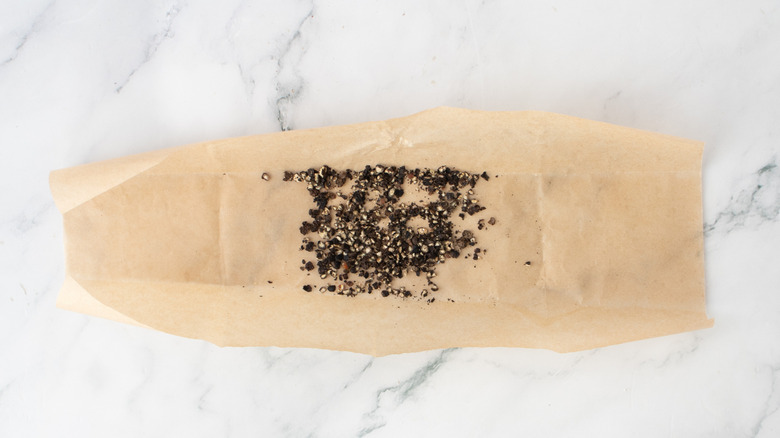 crushed peppercorns on a piece of paper