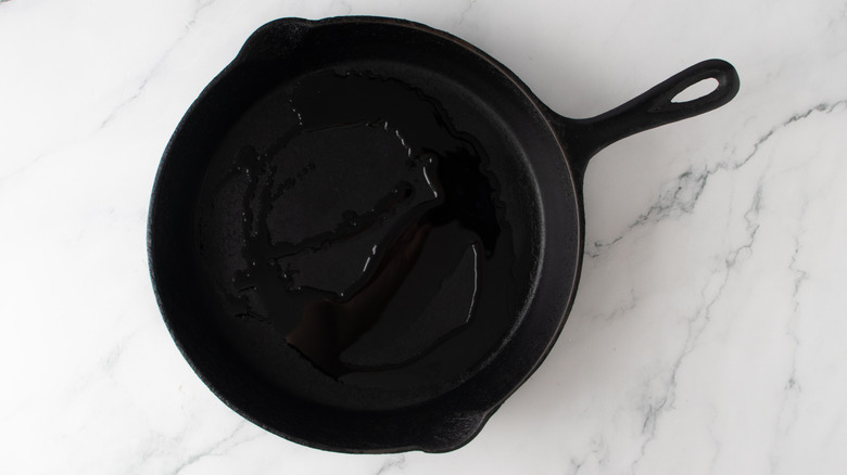 oil in a black frying pan