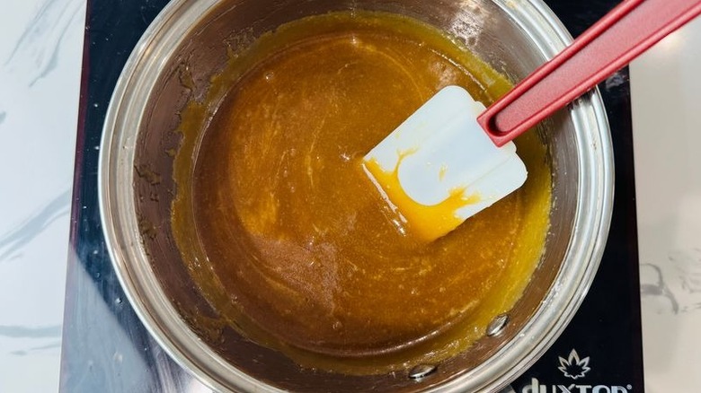 Caramel in saucepan with rubber spatula