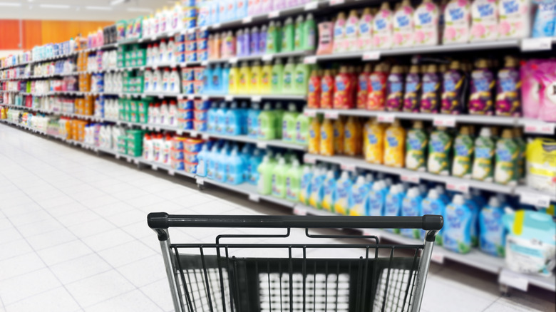Grocery store shopping cart in cleaning aisle