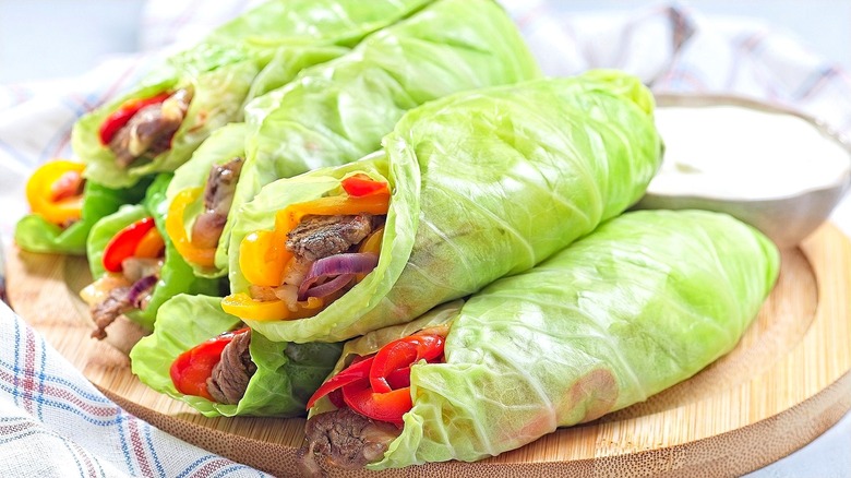 Steamed cabbage leaves stuffed with strips of beef and bell peppers