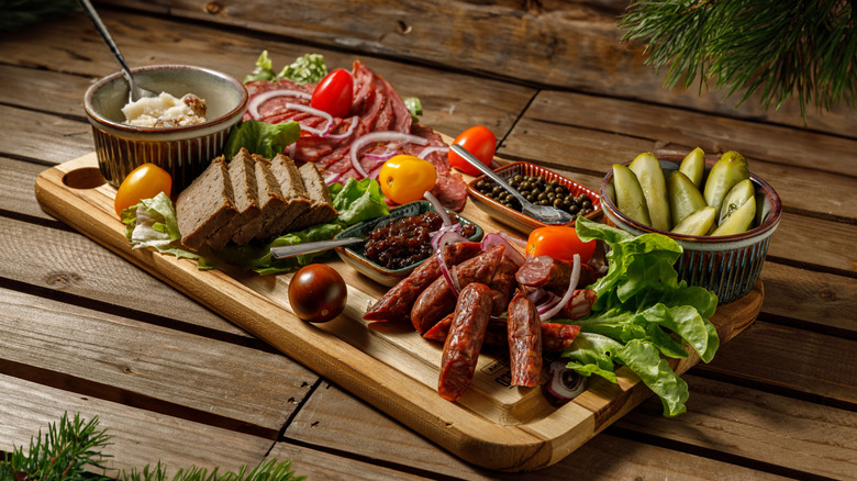 Charcuterie board on wooden background