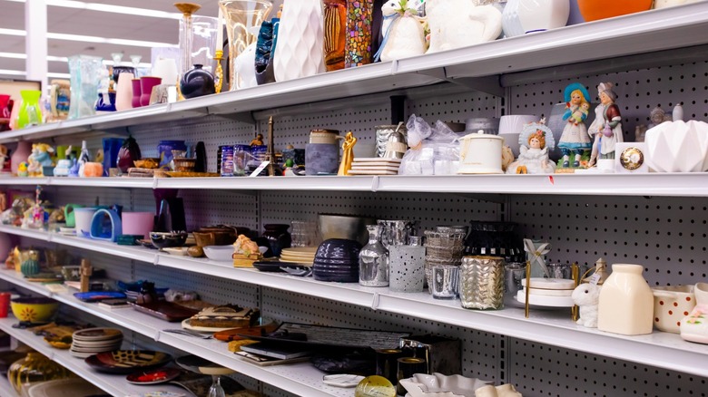 Secondhand goods on the shelf at a thrift store.