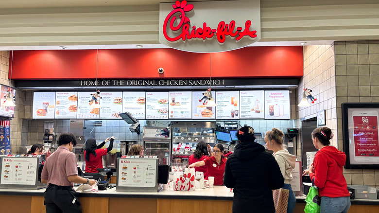People ordering at the counter at Chick-fil-A