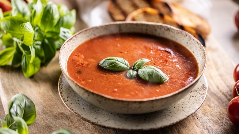 bowl of creamy tomato soup with basil