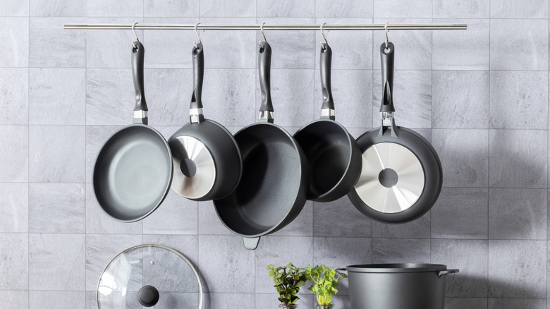 Cookware hanging on the wall in a kitchen