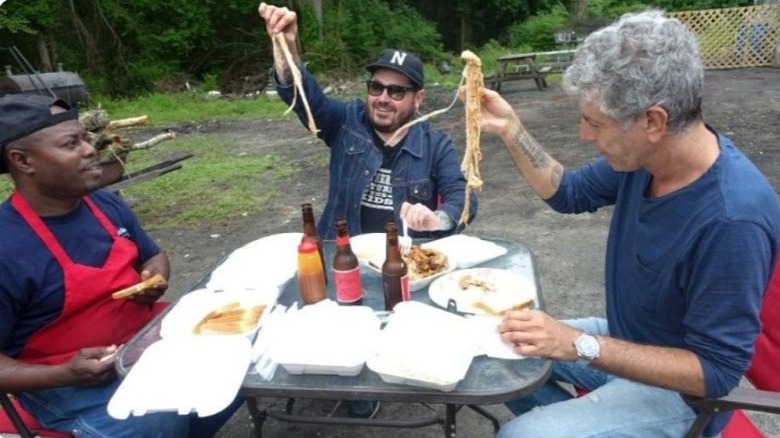 Rodney Scott, Sean Brock, and Anthony Bourdain eating pulled pork