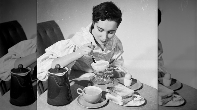 Vintage image of a woman eating breafast