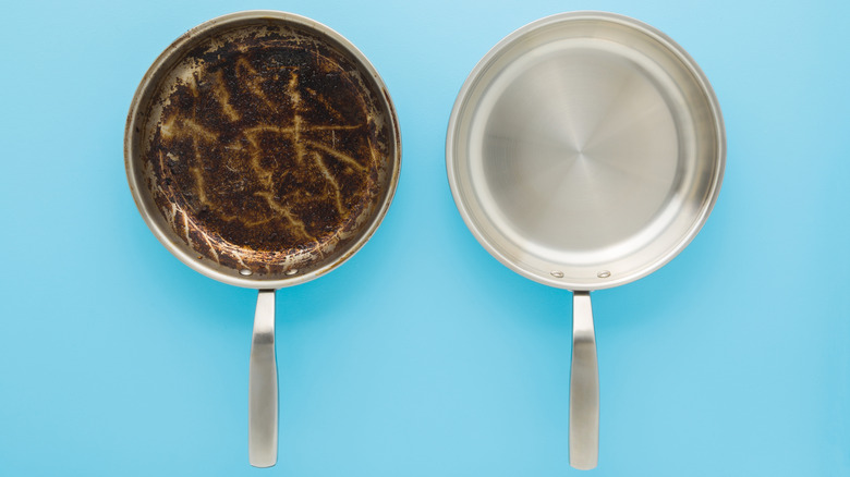 A blackened pan next to a clean one on a blue background