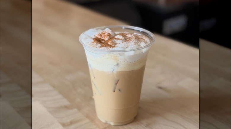 Cup of iced coffee with cinnamon topping