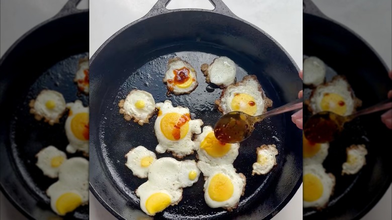 Eggs in a pan with chili oil