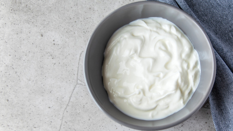 Bowl of Greek yogurt with towel