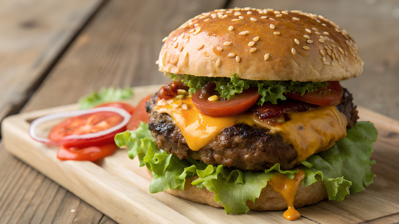 cheeseburger on a wooden board