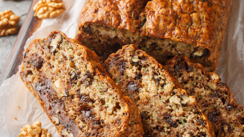 sliced loaf of banana bread on board