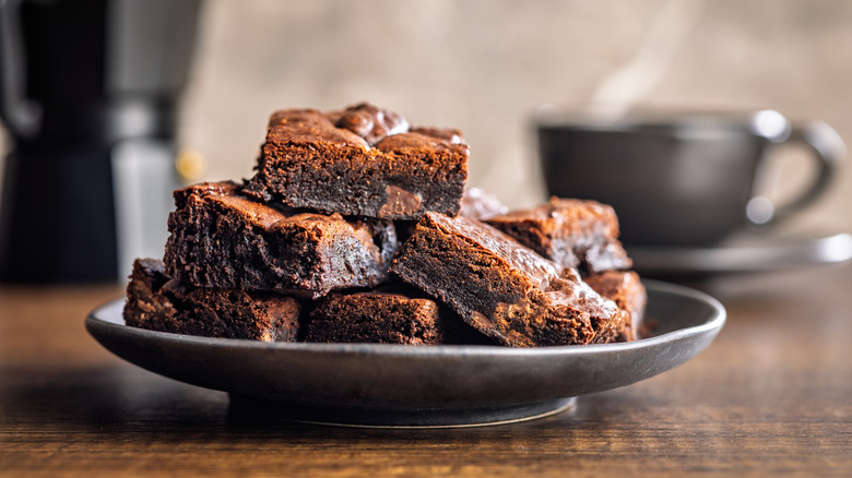 Brownies cut and stacked on a plate