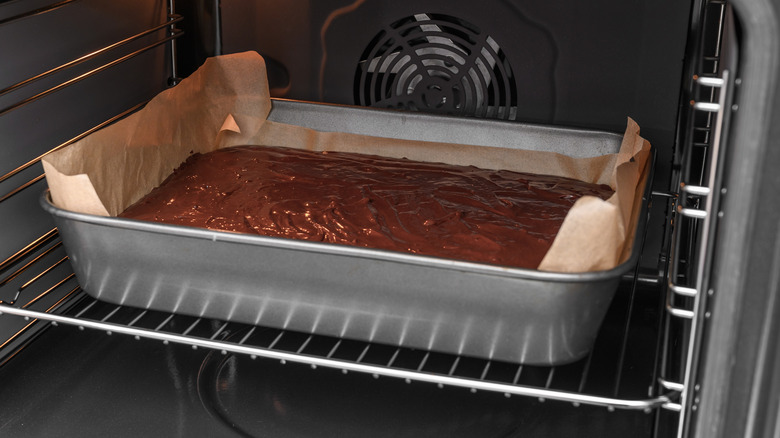 Pan of brownie batter in an oven