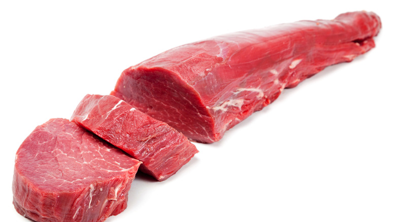 sliced beef tenderloin on white background