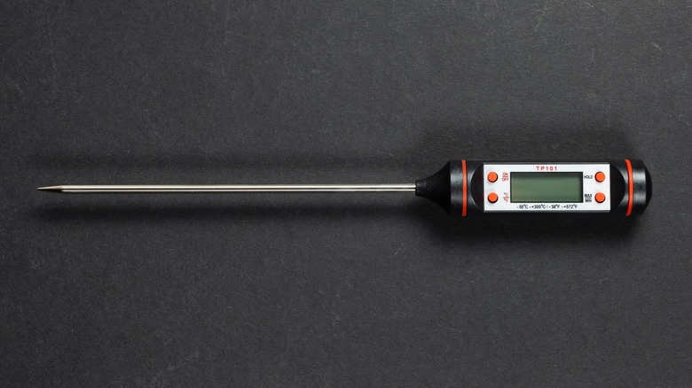 digital kitchen thermometer on dark background