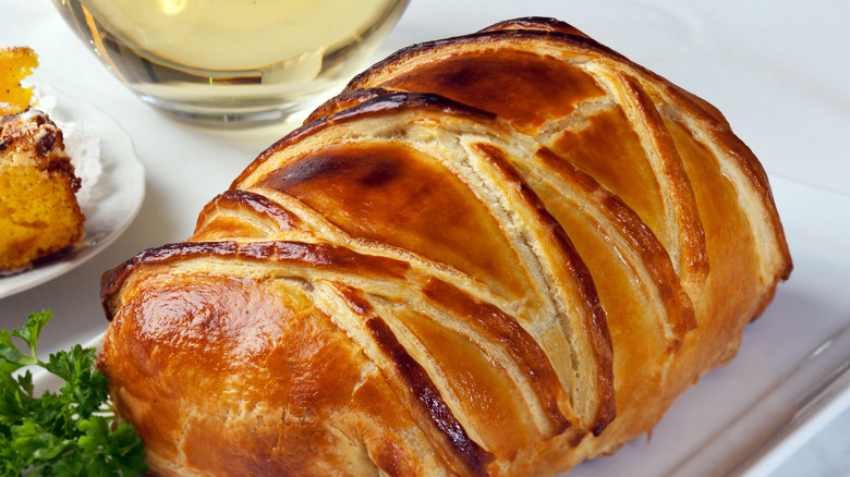 whole beef Wellington sitting on table