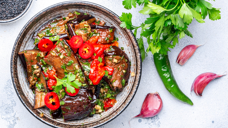 A salad of marinated grilled eggplant and peppers
