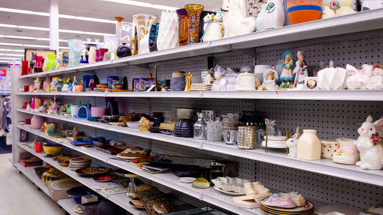 Various trinkets on display across thrift store shelves.