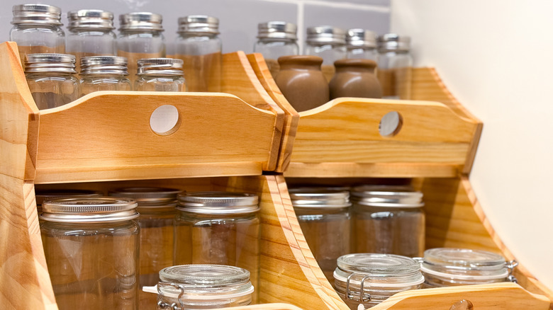 Wooden display cases filled with glass spice jars.