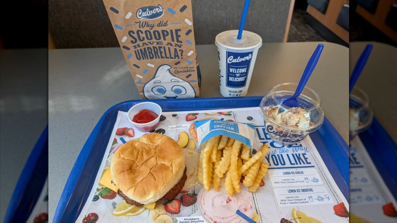 Kids menu order on paper lined blue tray in Culver's restaurant.