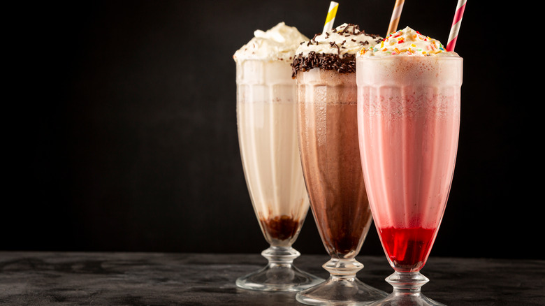 Three milkshakes in glasses 