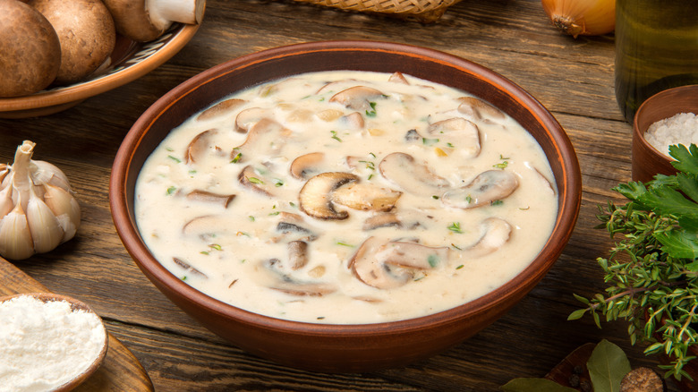 Homemade cream of mushroom soup in a terracotta bowl