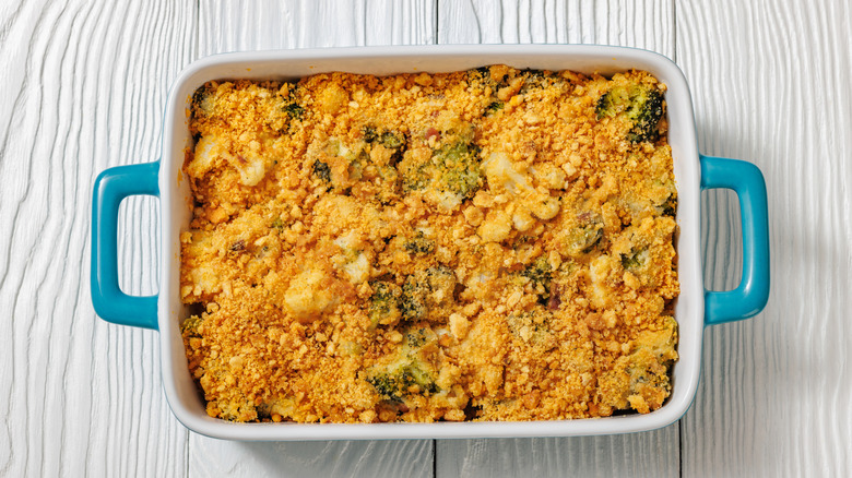 Broccoli cauliflower casserole in blue square casserole dish