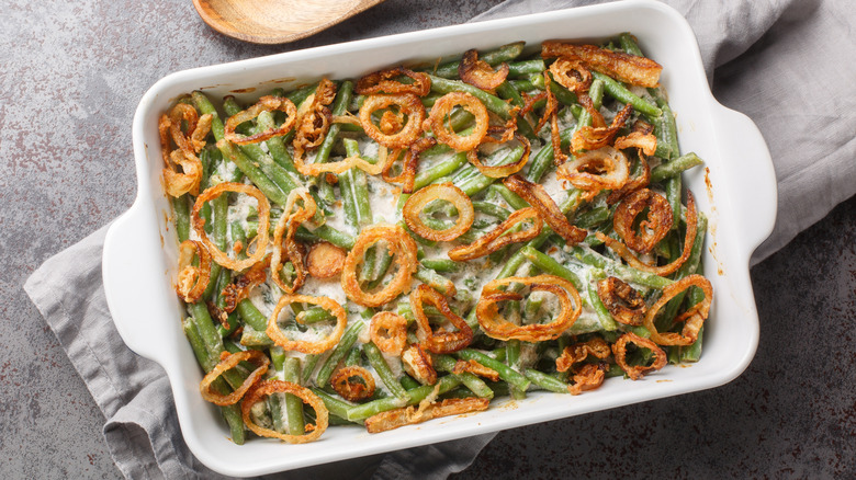 Green bean casserole in a white casserole dish