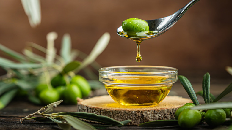 Spoon with olive oil