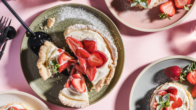 Summer cream cheese tarts decorated with fresh strawberries