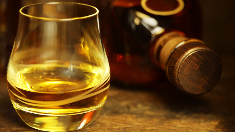 Whiskey glass and whiskey bottle