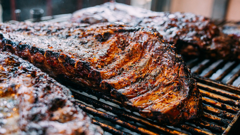 Seasoned pork ribs on a grill