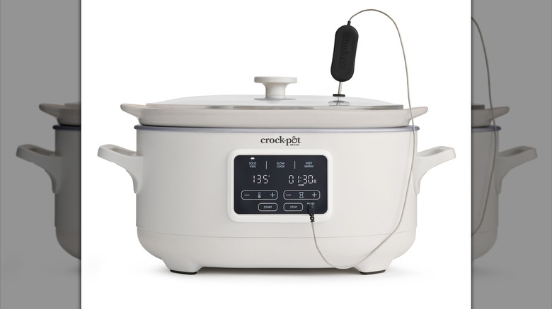 A wide white Crock-Pot with a temperature probe on the top