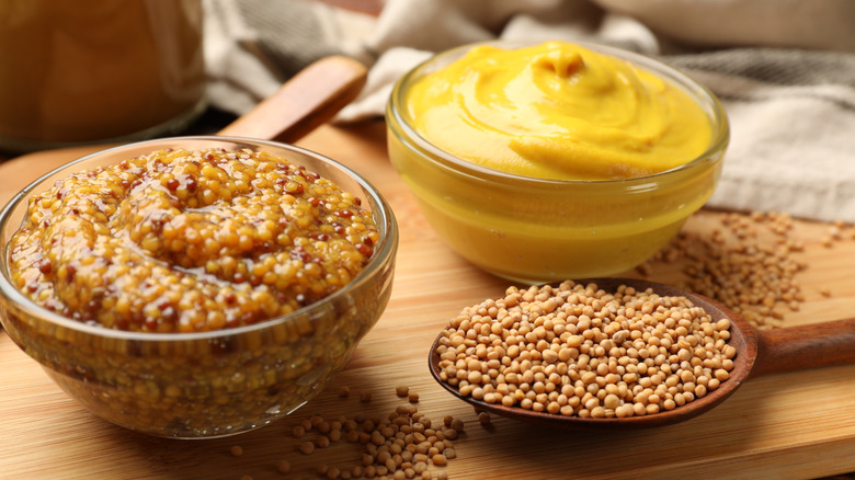 different styles of mustard in glass bowls