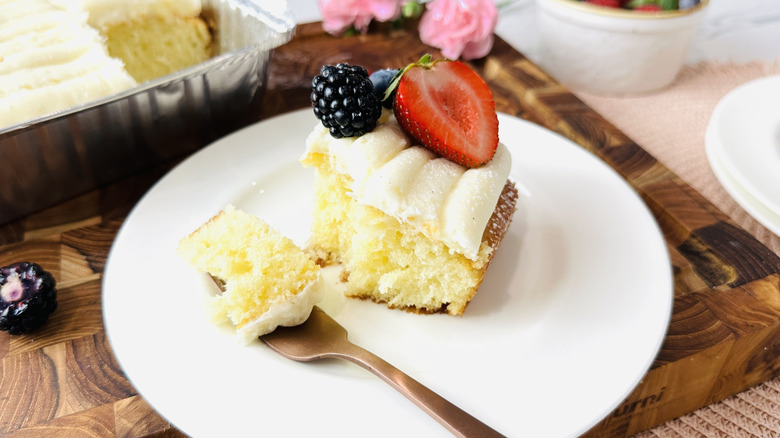 Serving slice of mini vanilla sheet cake