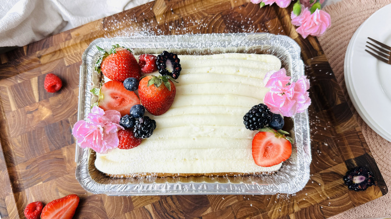 Trader Joe's copycat vanilla mini sheet cake topped with fruit and edible flowers
