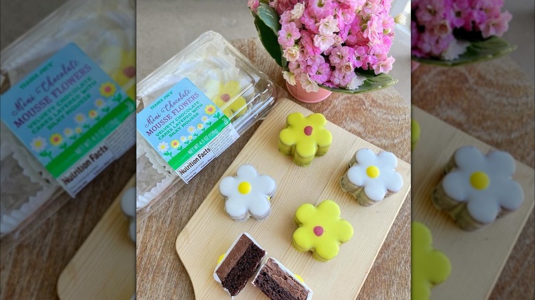 Package of Trader Joe's Mini Chocolate Mousse Flowers with some pieces beside it on a cutting board
